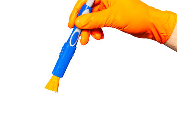 Washing concept. A male man hand with brush isolated on white background. Worker cleaning. Cleaning with cloth, foam and brush. Cleaning concept. Hand in orange protective rubber glove