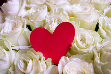 Roses flower bouquet with red heart