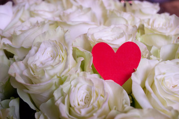 Roses flower bouquet with red heart