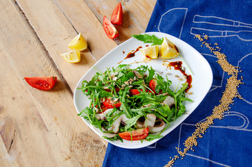 Fresh light salad with arugula , mushrooms, tomato in lemon-honey sauce. Healthy eating concept. proper nutrition