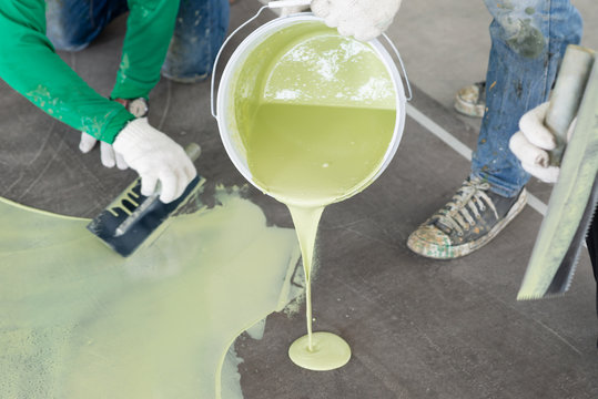 Construction series: Workers working on epoxy floor