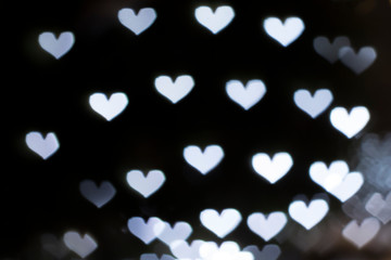 Silver background with bokeh hearts