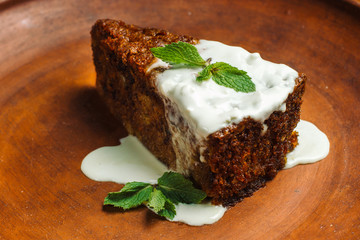 Piece of fresh baked homemade apple cake on a clay plate-2.