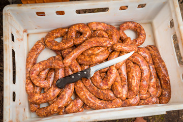 Freshly made delicious traditional pork sausages ready for baking