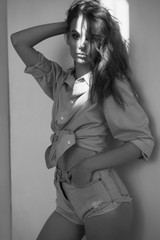 Lifestyle portrait of young woman with curly hair.