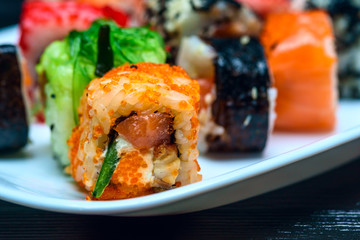 Sushi on a white plate photographed close up.