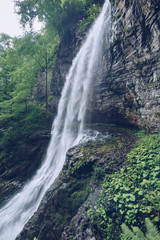 trail under the waterfall in the jungle muted color