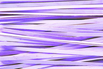 background of bright colored wooden sticks close-up