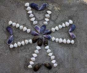 Maltese Cross done with shells on a house facade