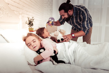 Nice pleasant cute girl hugging her fluffy toy