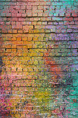 Fototapeta premium Textured Old Brick Wall with Colorful Splashes of Paint