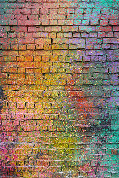 Textured Old Brick Wall with Colorful Splashes of Paint © Yat