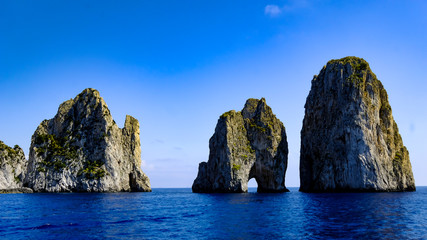 Beautiful rock formation erected from the ocean next to Capri island, Italy.