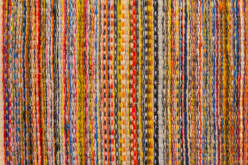 Vertically striped colorful wool texture handmade closeup