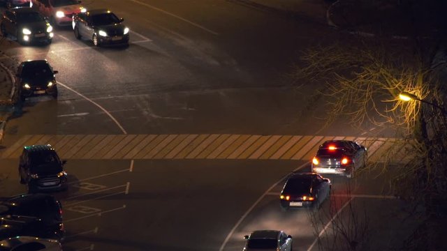 Cars go on the road at night