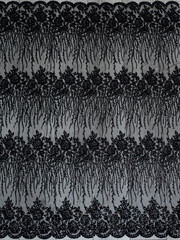 The texture of black lace on wooden background