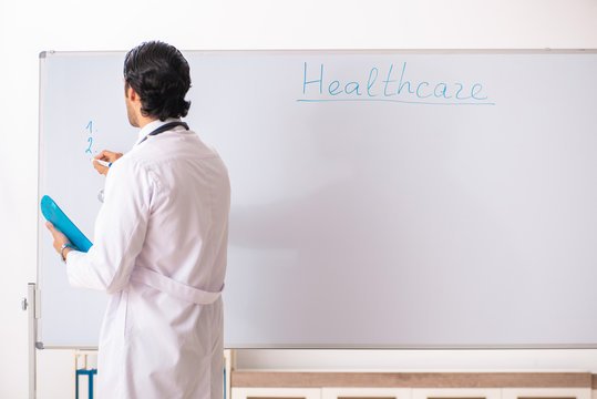 Young Doctor In Front Of Whiteboard 