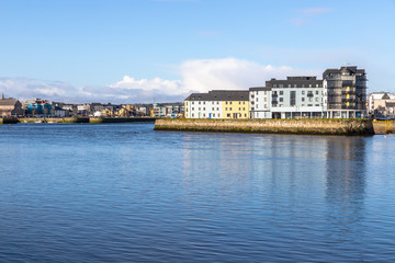 Fototapeta na wymiar Corrib river and Galway buildings with reflection