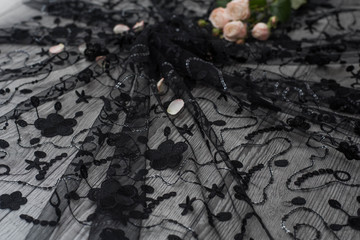 The texture of lace on wooden background decoreted roses.