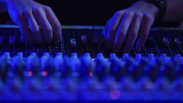 Big sound console, sound engineer at work
