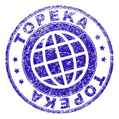 TOPEKA stamp imprint with distress style. Blue vector rubber seal imprint of TOPEKA tag with dust texture. Seal has words placed by circle and planet symbol.