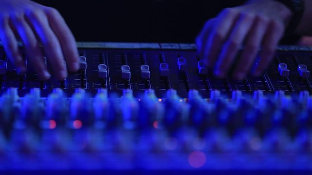 Big sound console, sound engineer at work