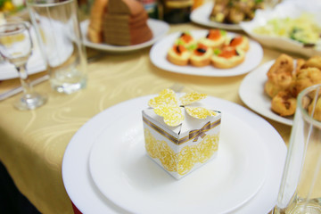gift for guests on a wedding plate
