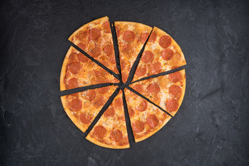 Italian pizza isolated on black background