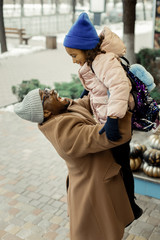 Loving father feeling amazing meeting his girl after kindergarten