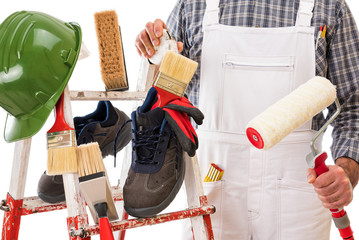 Professional house painter, tools and work equipment. © francescomou