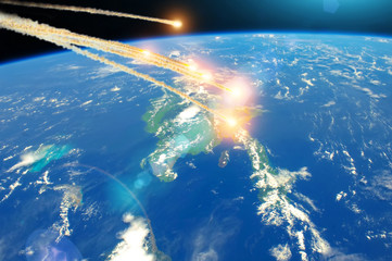 Meteorite falling from space over island Cuba, explosion in the atmosphere. Elements of this image furnished by NASA