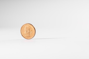 Dollar coin rotating on white background, concept of American economy.