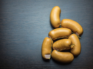 A group of wieners on a wood background