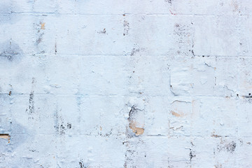 Brick wall, painted in blue paint. Brick light background.
