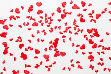 Valentines day background red hearts on wooden background.