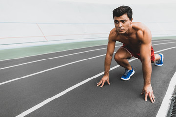 Obraz premium Orderly stripped to waist male doing workout