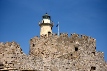The windmills,fort of St Nikolas,Church of the Assumption and the Governors palace are on Rhodes Mandraki Harbour 