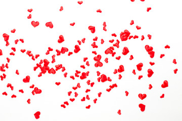 Valentines day background red hearts on wooden background.
