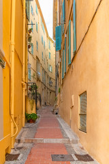 Menton, narrow street in the old town, French Riviera, typical houses