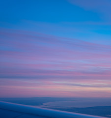 Obraz premium Aerial view of Comporta Troia bay from the plane, beautiful purple sunset