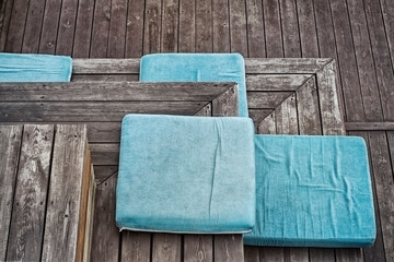 Turquoise seat pad on the boardwalk stairs