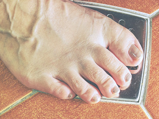 Adult caucasian female foot  in shower.