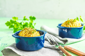 Delicious portion baked potatoes with green onion and cheese