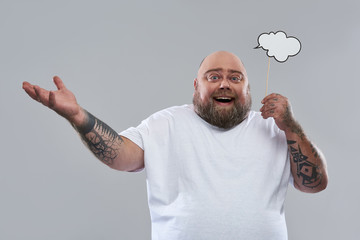 Funny man gesturing while standing with thought cloud