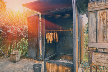 Traditional norwegian salmon smoking process in the country restaurant in the mountains. Smoked...