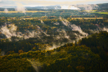 Foggy landscape. Misty foggy morning with sunrise in a valley of Bohemian Switzerland park. Detail of forest, landscape of Czech Republic, beautiful national park Bohemian Switzerland.