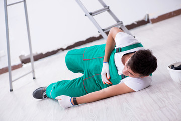 Young worker falling from the ladder 