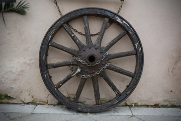 Old Towing Wheel Chained with Chains