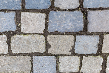 stone surface many cobblestone lines cement rectangular light beige gray pattern weathering hard surface