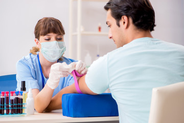 Young patient during blood test sampling procedure  